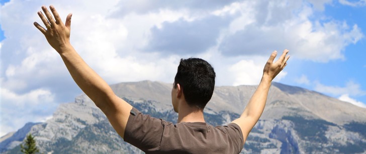 Prayer-Man-with-lifted-hands-in-front-of-mountain_thumb